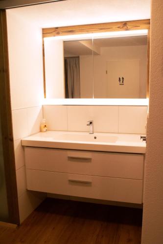 a bathroom with a sink and a mirror at einzigartiges stylisches Loft im Grünen in Zell