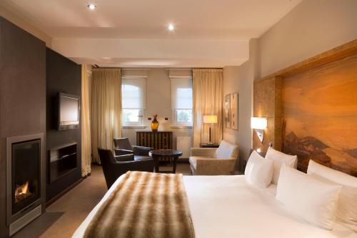 Postel nebo postele na pokoji v ubytování Le Parc Hôtel Obernai & Yonaguni Spa