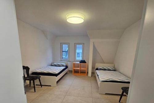Ένα ή περισσότερα κρεβάτια σε δωμάτιο στο Work & Stay in Troisdorf