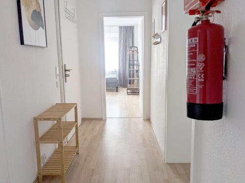 a fire hydrant hanging on a wall in a room at Beautiful Apartment in Velbert in Velbert