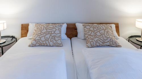 Postel nebo postele na pokoji v ubytování Ferienwohnung im Ötzergut - Your Austrian Home