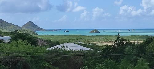 a view of a beach with boats in the water at Zeus Estate Guest House 2 in Grays Hill