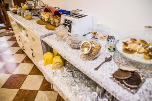 a buffet line with plates of food on it at Art&Coffee in Verona