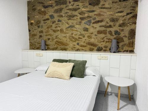Ένα ή περισσότερα κρεβάτια σε δωμάτιο στο Agi Pi Sunyer Apartments