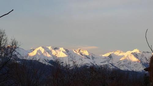 a mountain range with snow covered mountains in the distance at CASA di SILVA tra MONTI e LAGHI PERLEDO REGOLEDO in Regoledo