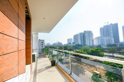a balcony with a view of a city at FabExpress AR Suites in Gurgaon