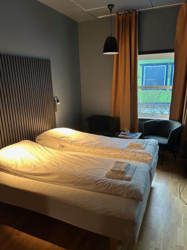 Postel nebo postele na pokoji v ubytování True Vesterålen Hotel