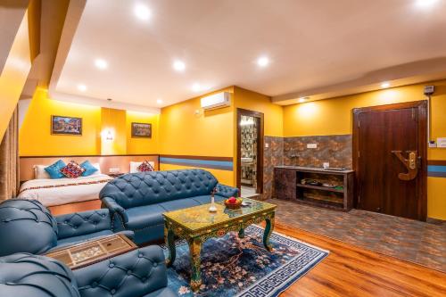 a living room with a couch and a bed at Hotel Yukhang in Kathmandu