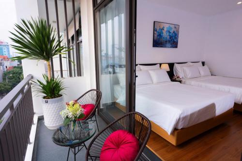 Ένα ή περισσότερα κρεβάτια σε δωμάτιο στο CELINA HOTEL Ninh Bình