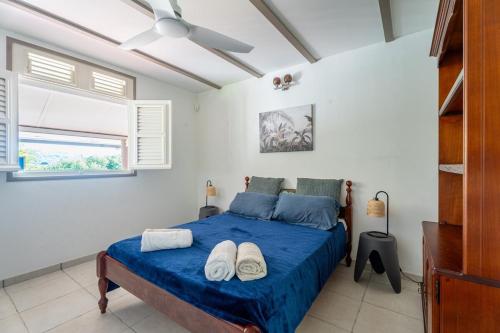 Llit o llits en una habitació de Villa Caféière