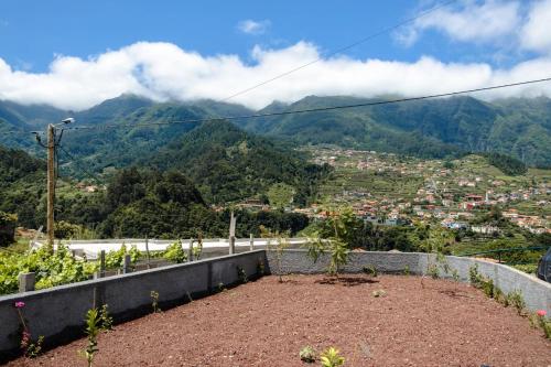 a view of a city with mountains in the background at GuestReady - Tranquil Retreat in Nature's Embrace in São Vicente