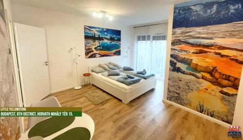 a living room with a couch and a large painting at Little Americas National Parks Apartments in Budapest