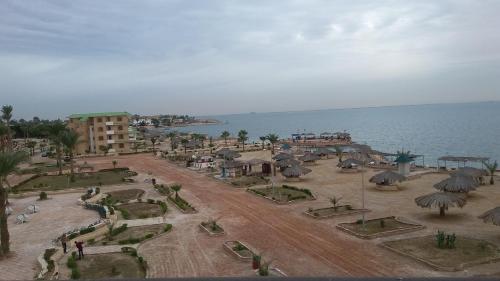 an aerial view of a resort near the water at Fanara Apartments Armed Forces in Fayed