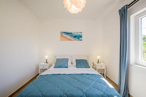 Postel nebo postele na pokoji v ubytování Apartments Morska Vila