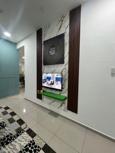 Μια τηλεόραση ή/και κέντρο ψυχαγωγίας στο Villa Umar Home Stay