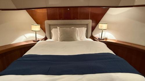 a bedroom with a large bed with two lamps at Xanquete in Valencia