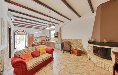 a living room with a couch and a fireplace at Parisi in Floridia