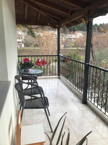 a balcony with a table and chairs and a view at Memories in Tríkala
