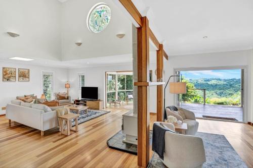 a living room with a couch and a tv at The Avenue at Montville (House) in Montville
