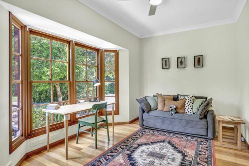 a living room with a couch and a table at The Avenue at Montville (House) in Montville