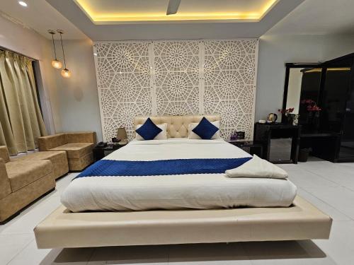 Ένα ή περισσότερα κρεβάτια σε δωμάτιο στο Hotel MK Vivanta