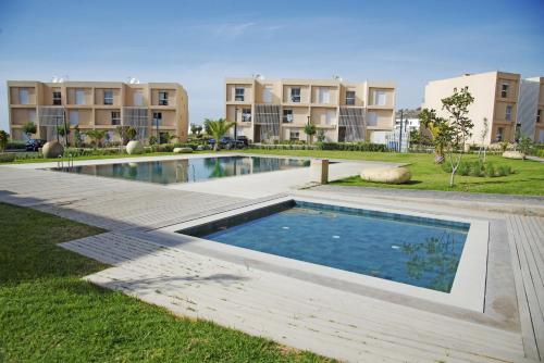 Bazén v ubytování Appartement luxe vue Mer & Golf -Taghazout Bay nebo v jeho okolí