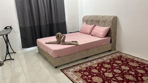 Ένα ή περισσότερα κρεβάτια σε δωμάτιο στο Double H Homestay