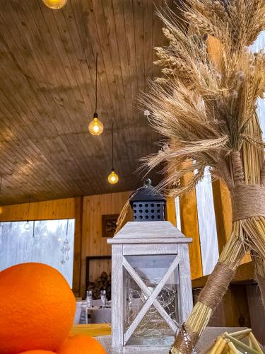 a table with a lantern and a palm tree at Sherwood Lake Hotel in Berezovka