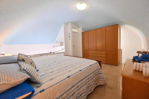 Postel nebo postele na pokoji v ubytování Beach House Ischia