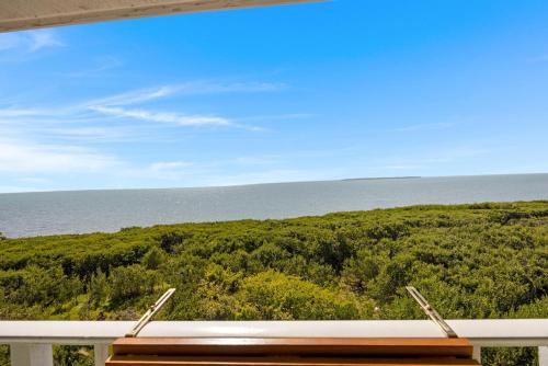 a view of the ocean from the balcony of a house at Salty Mermaid Ocean Pointe 4406 in Tavernier