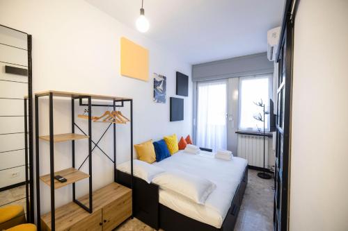 Ένα ή περισσότερα κρεβάτια σε δωμάτιο στο Loft Moderno a due passi da San Siro Fiera Milano