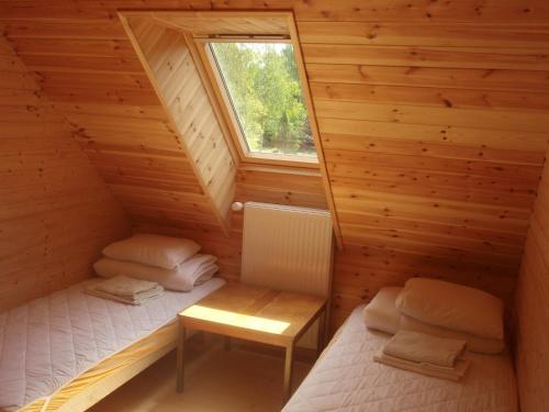 Кровать или кровати в номере Pauka Holiday House