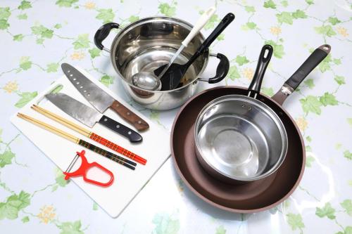 a pot sitting on top of a plate next to a knife at サザンコースト湘南 in Chigasaki