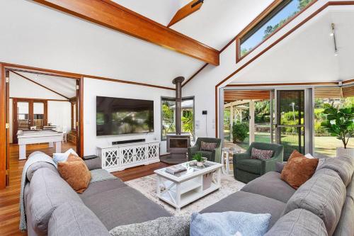 a living room with a couch and a tv at Escape to Darlington Bliss Serene Nature Retreat in Darlington