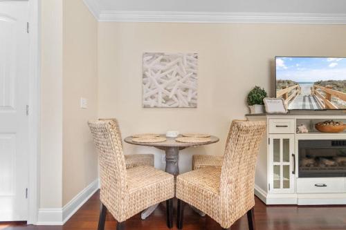 a dining room with a table and two chairs at The Red Door House in Historic Georgetown in Georgetown