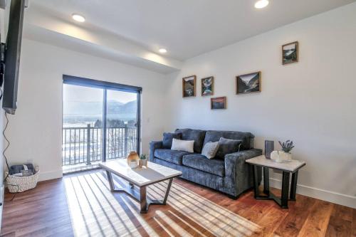 a living room with a couch and a table at Cozy Retreat With Breath Taking Views 303 in Juneau