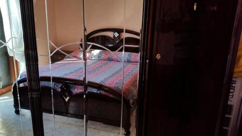 a bedroom with a bed with a black frame at B&B RoMa Atella in Atella