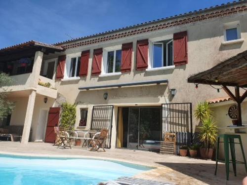 Chambre chez l'habitant avec piscine et cuisine d'été