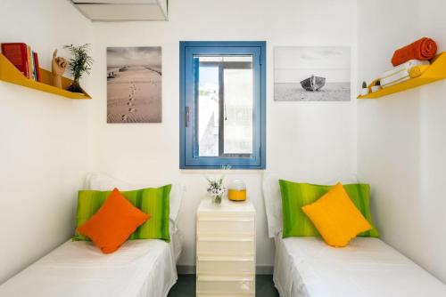 Una cama o camas en una habitación de Manzoni17, moderno appartamento a 100 mt dal mare - Marea Stays Collection
