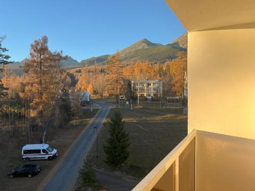 a view from a balcony of a house and a street at Apartmán Gerlach - 4 balconies mountain view in Vysoké Tatry
