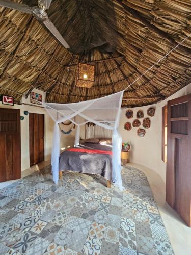 Postel nebo postele na pokoji v ubytování Cabaña Los Gallitos Ecolodge