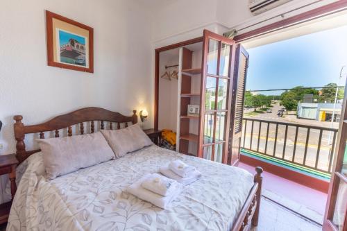 En eller flere senge i et værelse på Hotel Atero