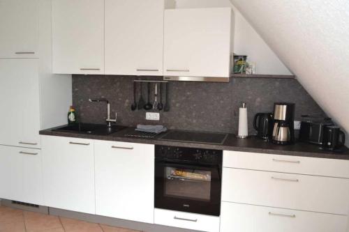 Η κουζίνα ή μικρή κουζίνα στο 4-Sterne Ferienwohnung Allium in Brüggen