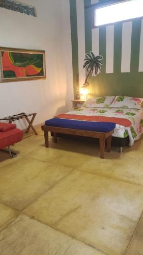 a bedroom with a bed in a room at Hotel Campestre Villa Nico in Bochalema