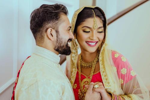 a bride and groom smiling at each other at Park Plaza Jalandhar in Jalandhar
