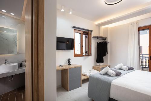 PROVILLAS - Ι, ΙΙ & ΙΙΙ - Luxury Villas with private pool near Retrymnoにあるベッド