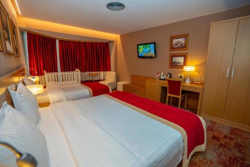 Postel nebo postele na pokoji v ubytování Hotel Colosseo & Spa