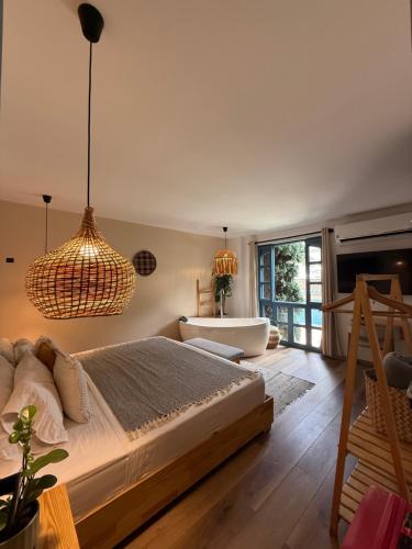 Postel nebo postele na pokoji v ubytování Poblado Luum Boutique hotel