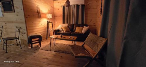a living room with a couch and a table at Laslu in Punta Del Diablo