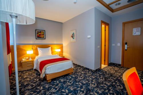 Postel nebo postele na pokoji v ubytování Hotel Colosseo & Spa